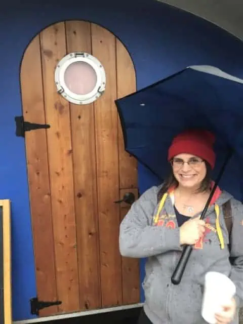 Erin next to a Tiny house