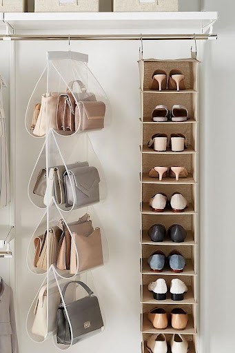 Hanging handbags and a vertical shoe storage solution in a small closet space, maximizing organization.
