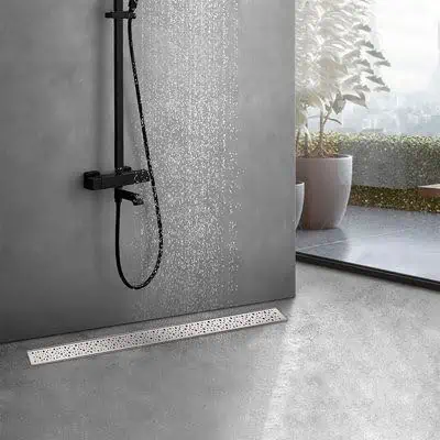 Contemporary small shower space with Linear Drain a matte black hand-held shower, linear drain, and a minimalistic approach.

