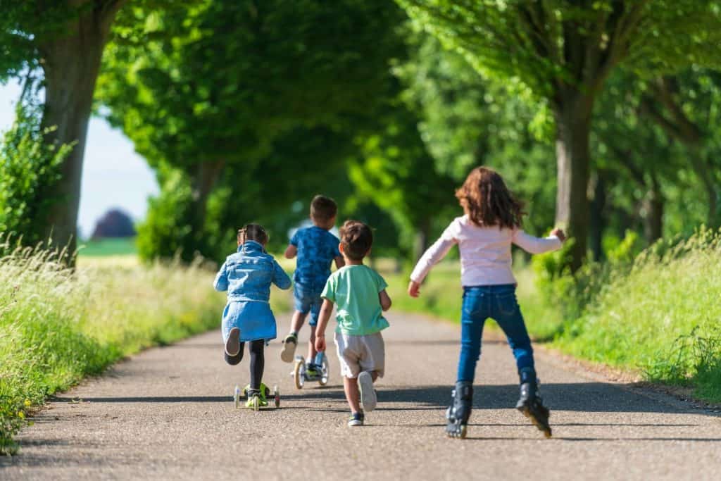 UNDERSTANDING HOPA: RULES FOR 55+ HOUSING COMMUNITIES 6 a group of kids rollerblading down a road